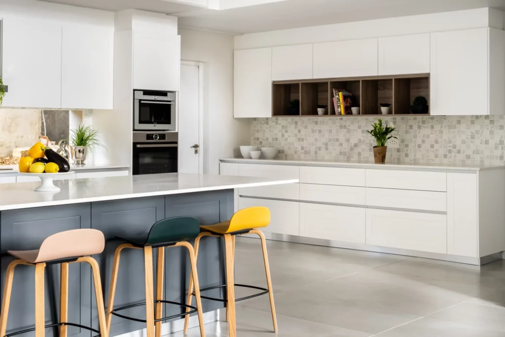 This contemporary kitchen showcases stunning shaker doors with Gola handles to tie everything together.