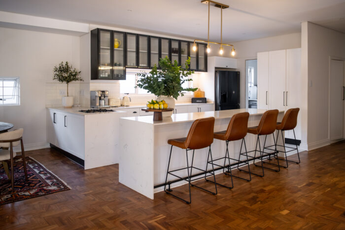 The kitchen design blends contemporary design with timeless elegance, creating a space that is both functional and visually striking.